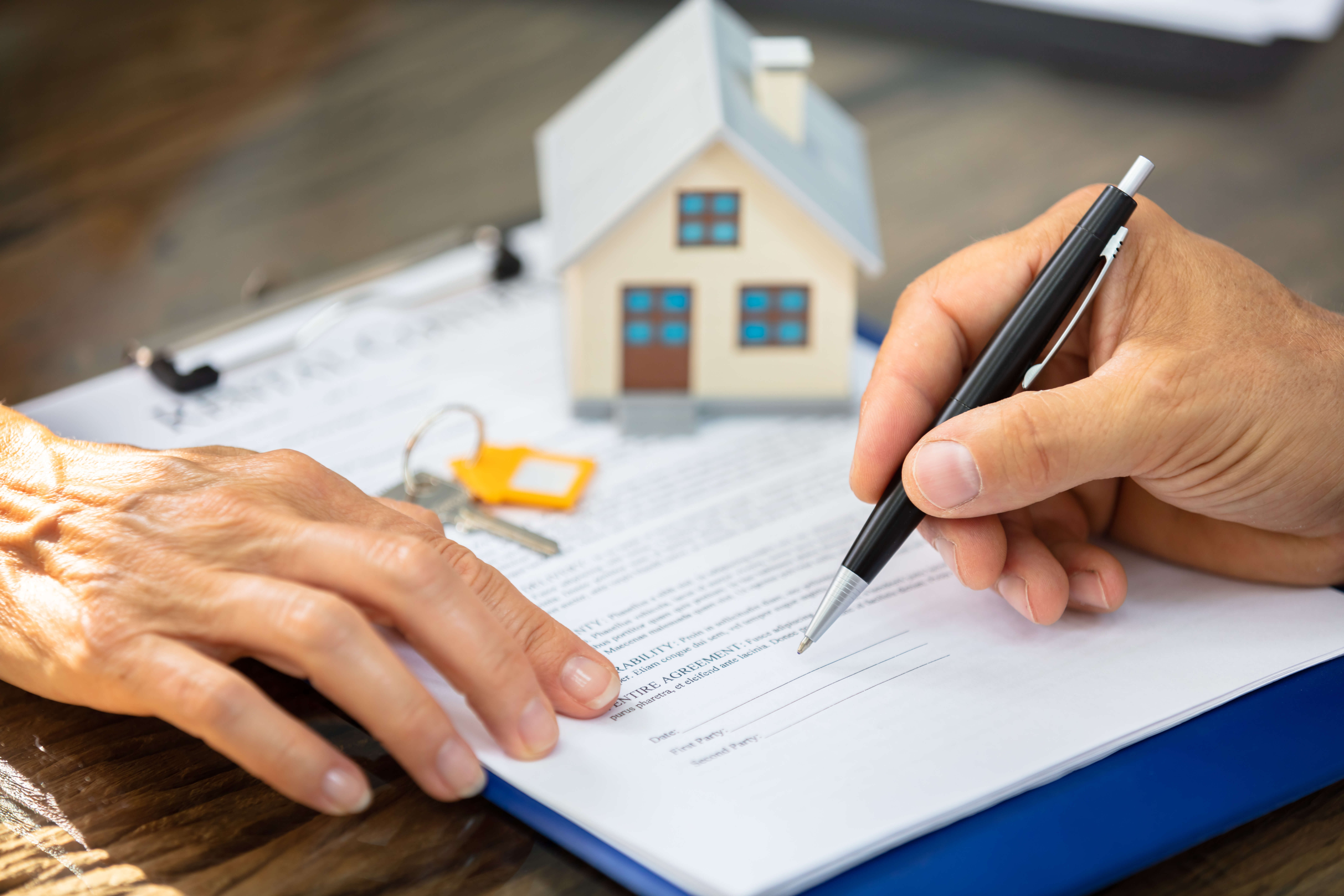 Person signing real estate documents