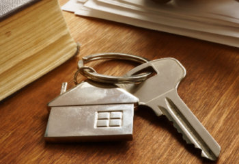 keys next to real estate book