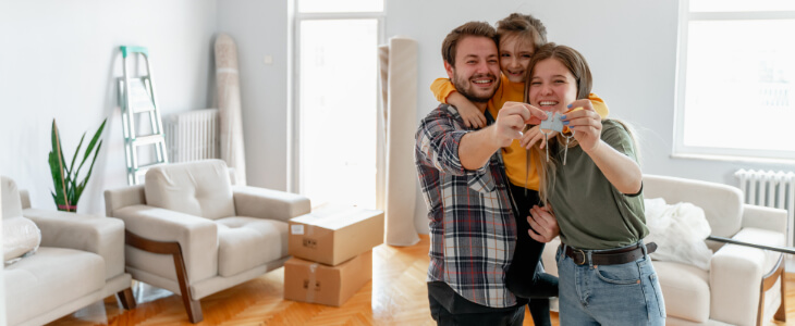 image of family celebrating access to their new home